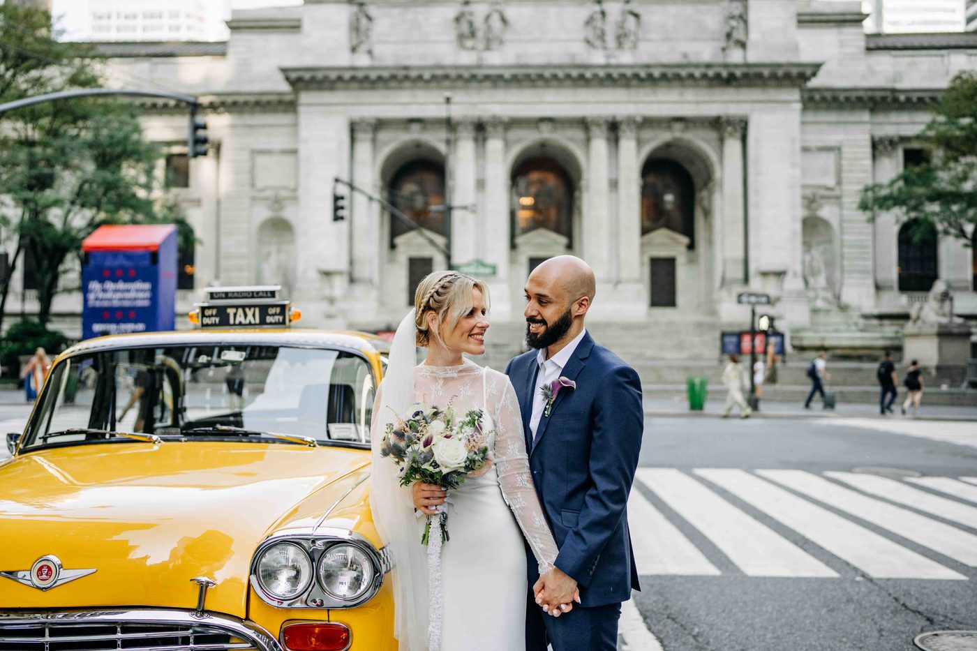 New York Public Library, couple with a classic yellow cab