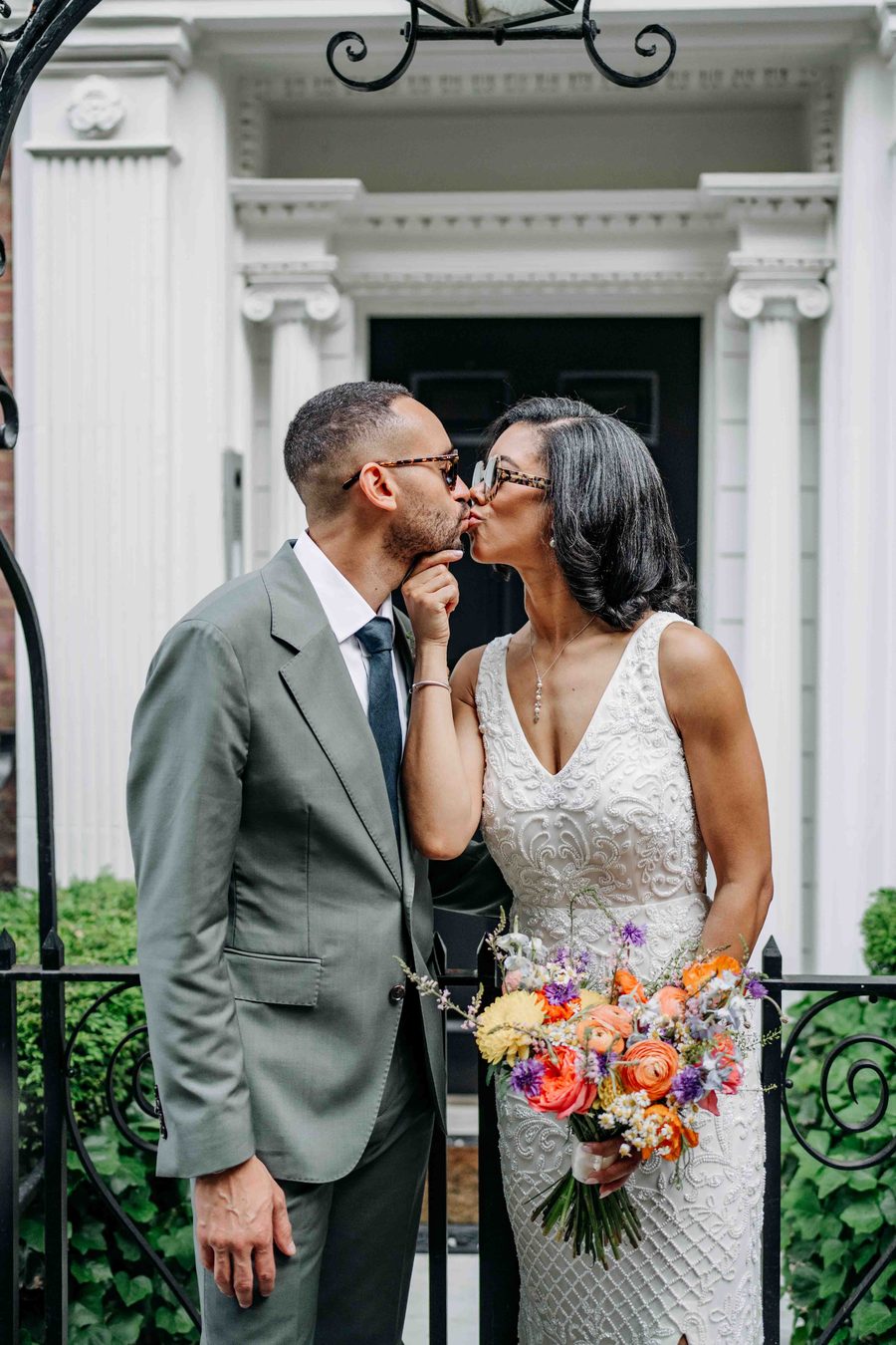 Couple kissing on brownstone steps, New York City